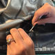 Gluing the layers of latex together for the suit